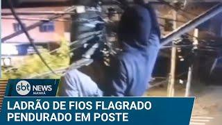 Ladrão é flagrado furtando fios de cobre pendurado em poste | #SBTNews Manhã (26/03/25)