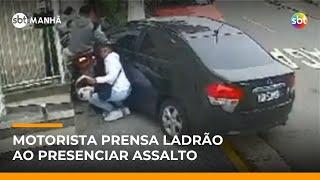 Motorista joga carro e prensa assaltantes ao flagra roubo em SP | #SBTManha