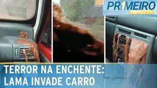 Casal fica em pânico com lama entrando em carro durante enchente | Primeiro Impacto (24/12/24)