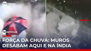 Mulher escapa de desabamento de muro durante forte chuva na Índia | #SBTNotícias