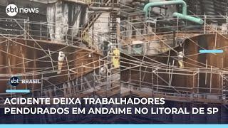 Trabalhadores ficam pendurados em andaime sobre tanque industrial no litoral SP | #SBTBrasil 