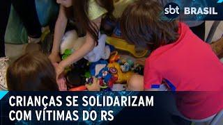 Brinquedos e cartinhas: crianças se solidarizam com vítimas do RS | SBT Brasil (10/05/24)