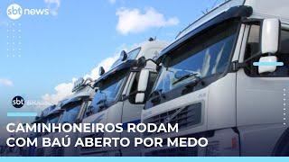Caminhoneiros rodam com baú aberto para evitar assaltos no Rio | #SBTBrasil 