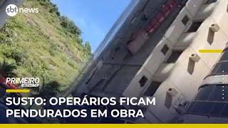 Trabalhadores de obra ficam pendurados após queda de plataforma | #PrimeiroImpacto