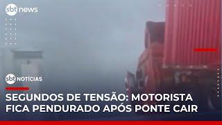 Caminhão fica pendurado à beira de rodovia após ponte desabar na China | #SBTNotícias