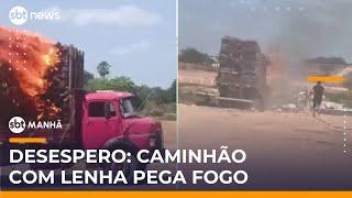 Caminhão com carga de madeira pega fogo e motorista lança veículo em rio | #SBTManhã