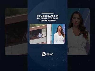 Tudo por vidro brilhando? Mulher se arrisca em parapeito para limpar janela | #SBTNotícias