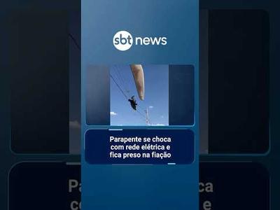 Piloto de parapente se choca com rede elétrica e fica preso na fiação | #SBTManhã