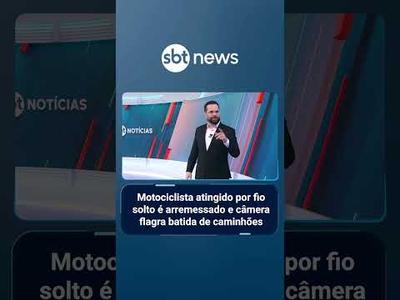 Motociclista atingido por fio solto é arremessado e câmera flagra batida de caminhões | #SBTNoticias