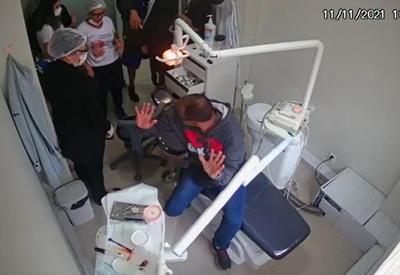Vídeo: policial reage a assalto em clínica odontológica no DF
