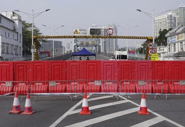 Imagem da noticia O dilema da covid-19: China está dividida entre conter doença ou empregos