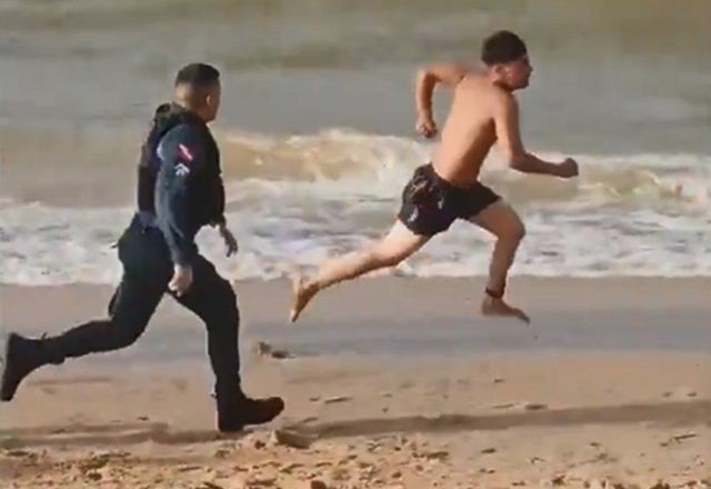 Flagra: Homem dá garrafada em namorada e é perseguido em praia