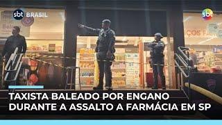 Taxista é baleado por assaltantes após ser confundido com segurança de farmácia  Taxista é baleado por assaltantes após ser confundido com segurança de farmácia