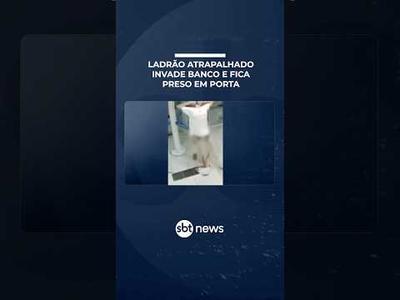 Bandido fica preso em porta giratória após tentar invadir agência bancária | #PrimeiroImpacto Bandido fica preso em porta giratória após tentar invadir agência bancária | #PrimeiroImpacto