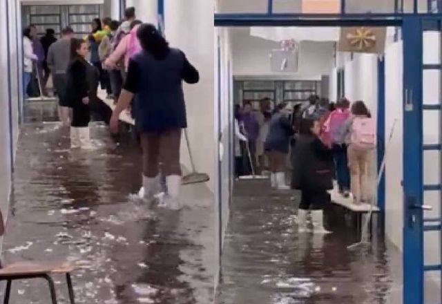 Imagem da noticia Alunos sobem em bancos para deixar escola alagada durante temporal no Paraná