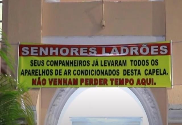 Imagem da noticia Padre faz faixa para ladrões pararem de roubar aparelhos de ar-condicionado