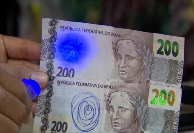 Imagem da noticia SP: mulher aplica golpe em lojistas com notas falsas de R$ 200